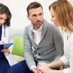 Canadian intended parents discussing donor wait times with a clinic