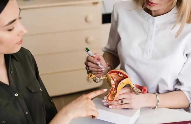 Physician reviewing ultrasound and AMH results during donor screening